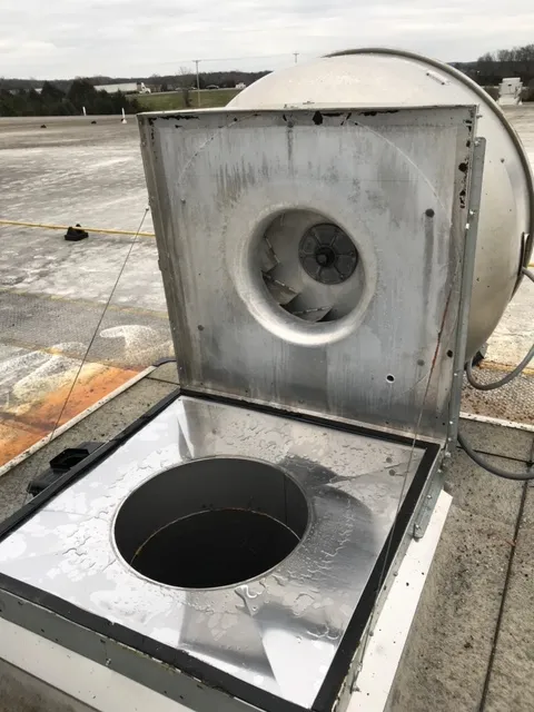 McLean hood cleaning technician servicing a commercial kitchen exhaust system